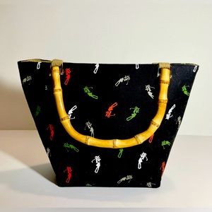 LIZ CLAIBORNE BLACK TOTE WITH GOLF PLAYER LOGO’s.  SNAP CLOSURE